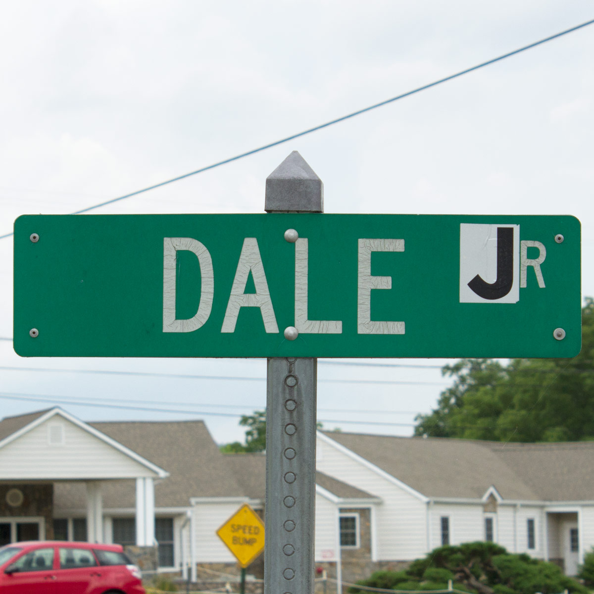 Street sign that once read ‘Dale Dr’ but now reads ‘Dale Jr’ as a result of someone having placed a sticker with the letter ‘J’ over the letter ‘D’ in ‘Dr’